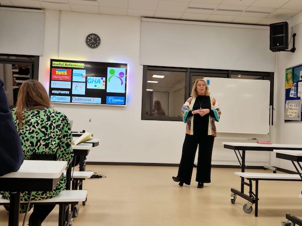 Jackie Linares from the Department of education speaks to parents, and invited guests about the positive collaboration being developed between agencies and praises the work of schools