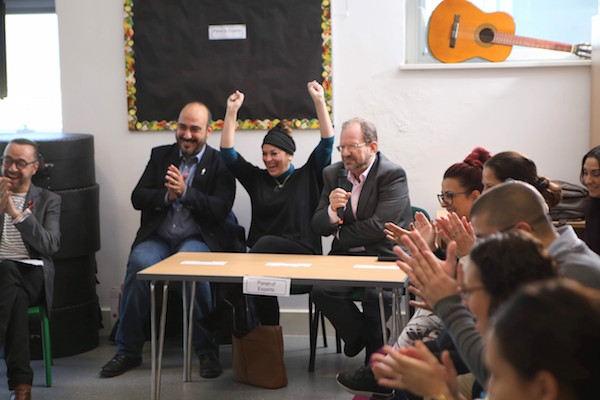 The elated reaction of everyone in the room as Minister Cortes promises four new Sea Bins