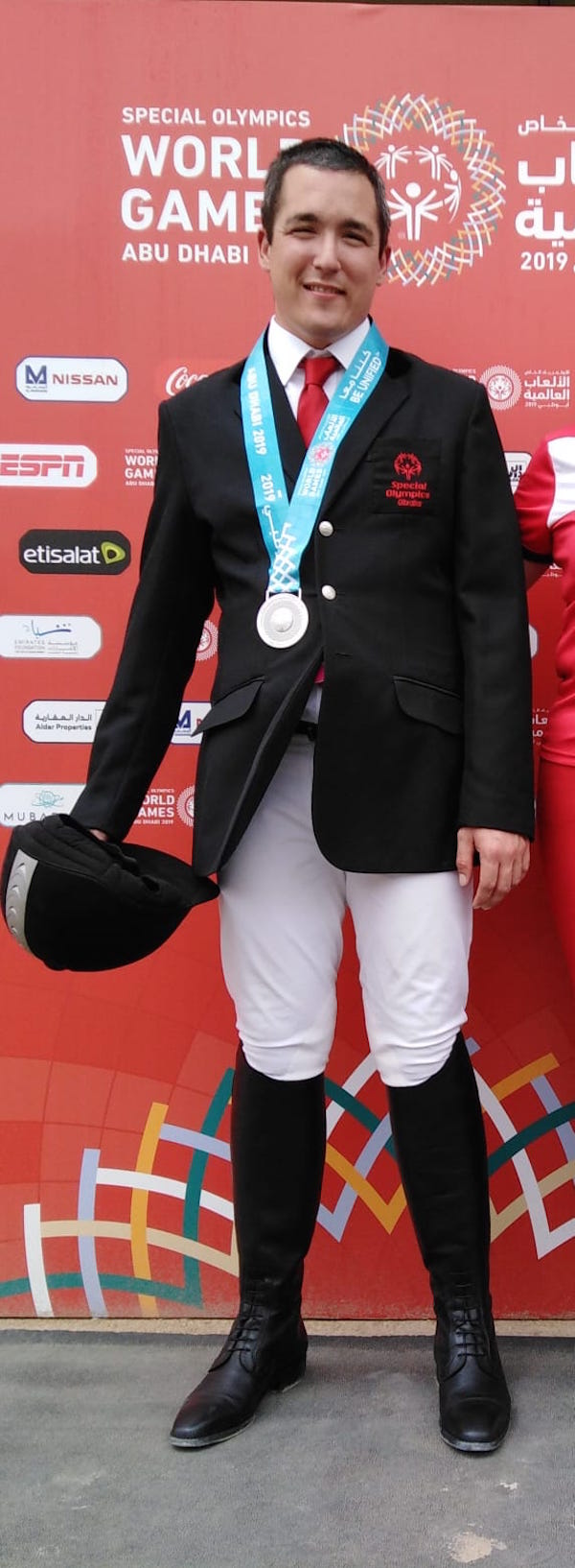 JJ Buttigieg with the first of his 2 silver medals in the equestrian event